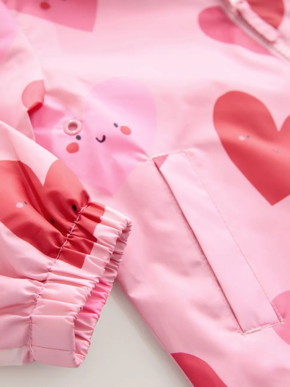 Roze met hartjesprint - Regenbestendig jack met print (3mnd-7jr)