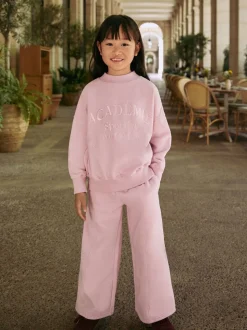 Roze met slogan - Set van sweatshirt en joggingbroek met wijde pijpen (3-16jr)
