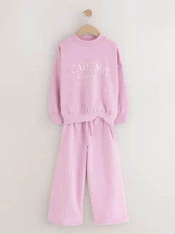 Roze met slogan - Set van sweatshirt en joggingbroek met wijde pijpen (3-16jr)