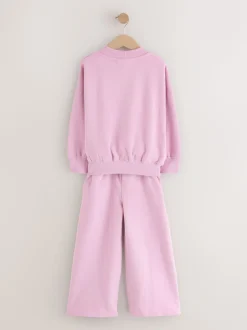 Roze met slogan - Set van sweatshirt en joggingbroek met wijde pijpen (3-16jr)