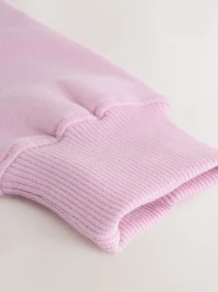 Roze met slogan - Set van sweatshirt en joggingbroek met wijde pijpen (3-16jr)