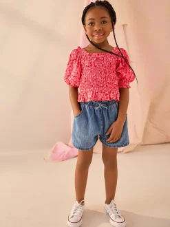 Roze met vrolijke print - Gesmokte blouse (3-16jr)