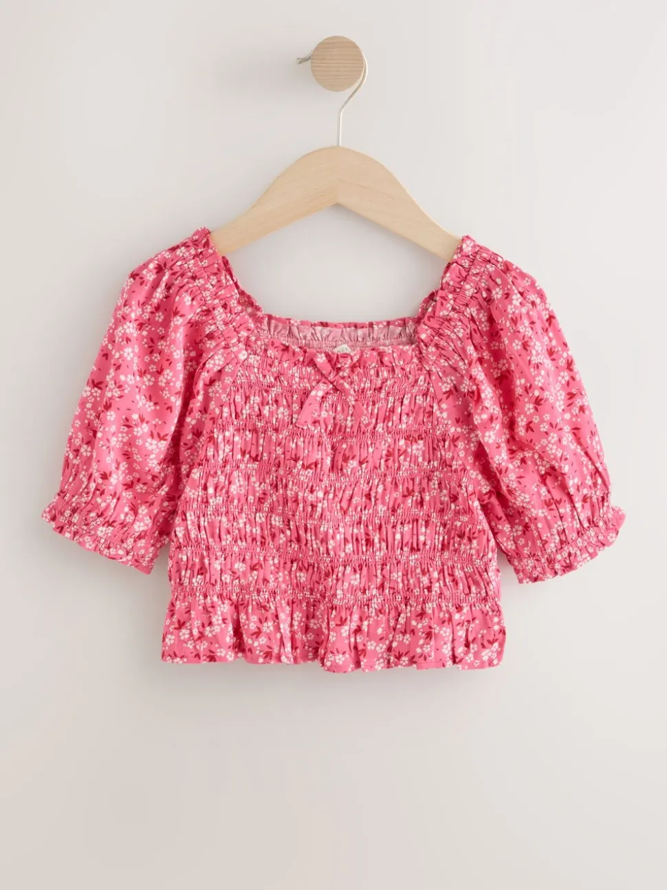 Roze met vrolijke print - Gesmokte blouse (3-16jr)