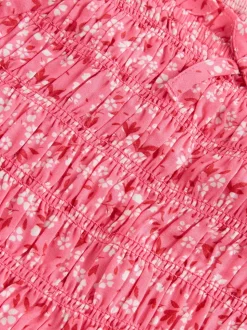 Roze met vrolijke print - Gesmokte blouse (3-16jr)