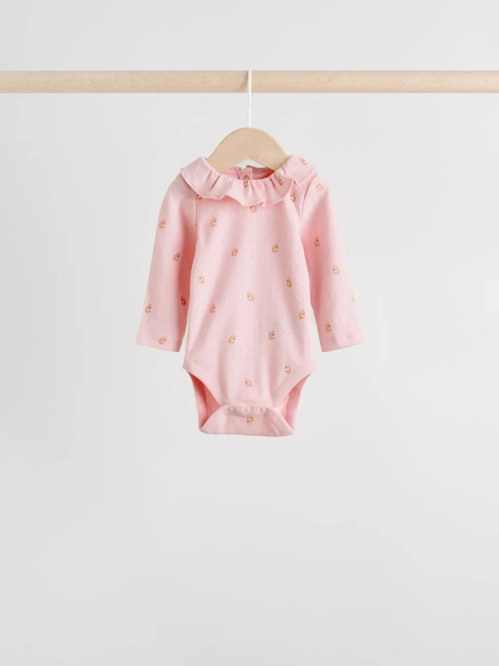 Roze/crème/bruin met fijne bloemetjesprint - Verpakking van 4 babyrompers met lange mouwen en ruches (0mnd-2jr)