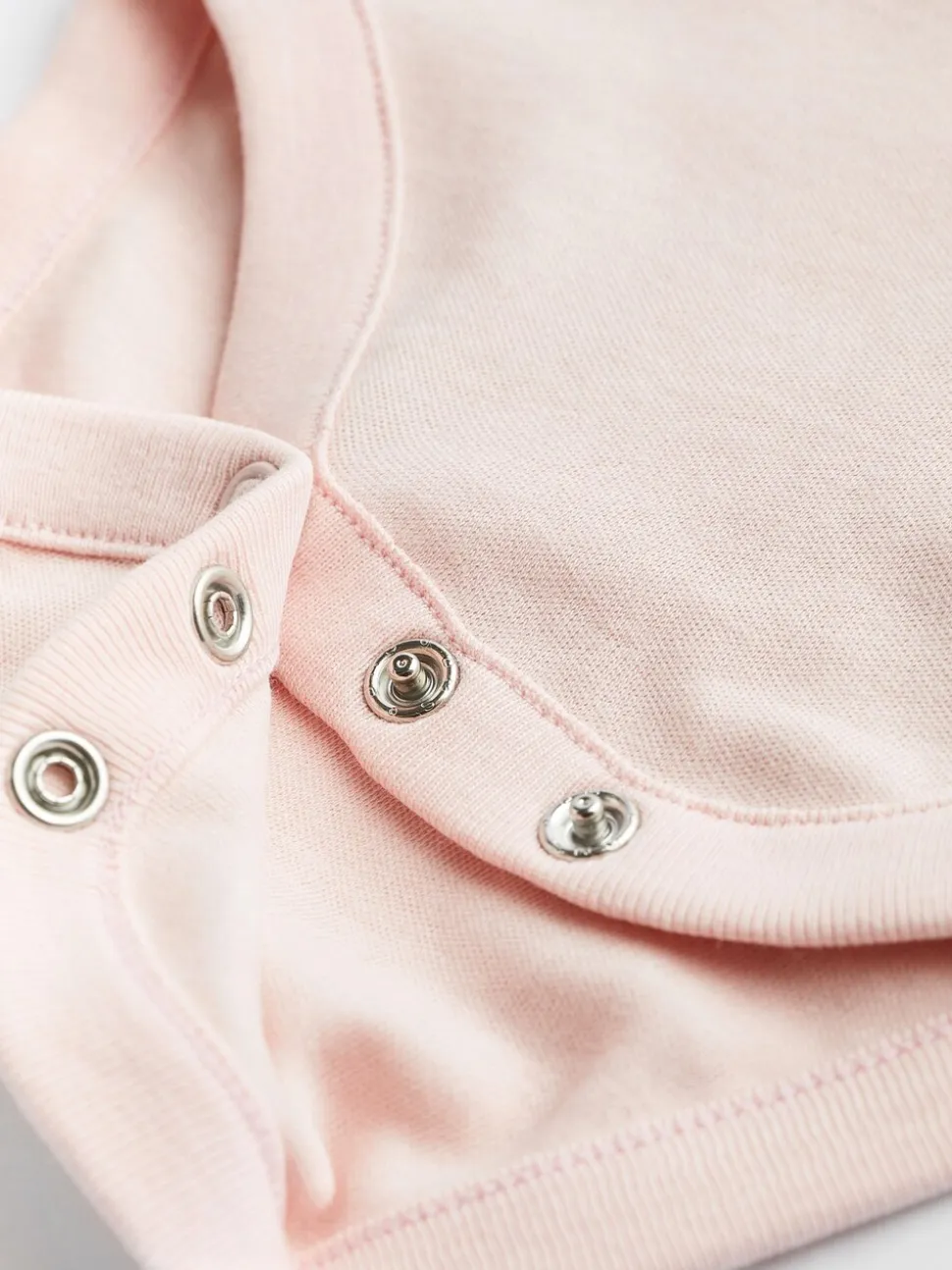 Roze/wit - Onmisbare rompertjes met lange mouwen