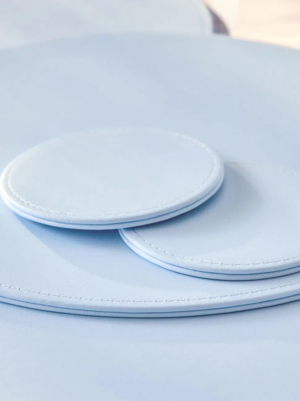 Set van 4 omkeerbare placemats en onderzetters van imitatieleer