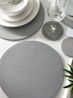 Set van 4 omkeerbare placemats en onderzetters van imitatieleer