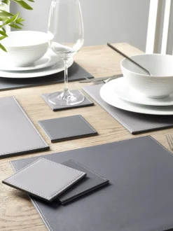 Set van 4 omkeerbare placemats en onderzetters van imitatieleer