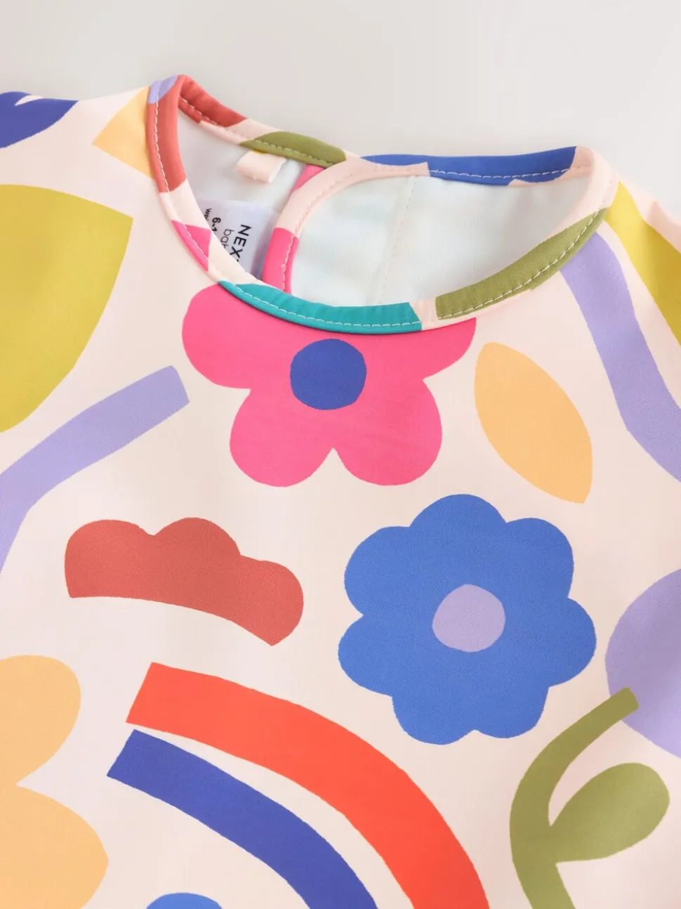 Stampy Bloemenprint - Slabbetje met mouwen voor spenen en voeden