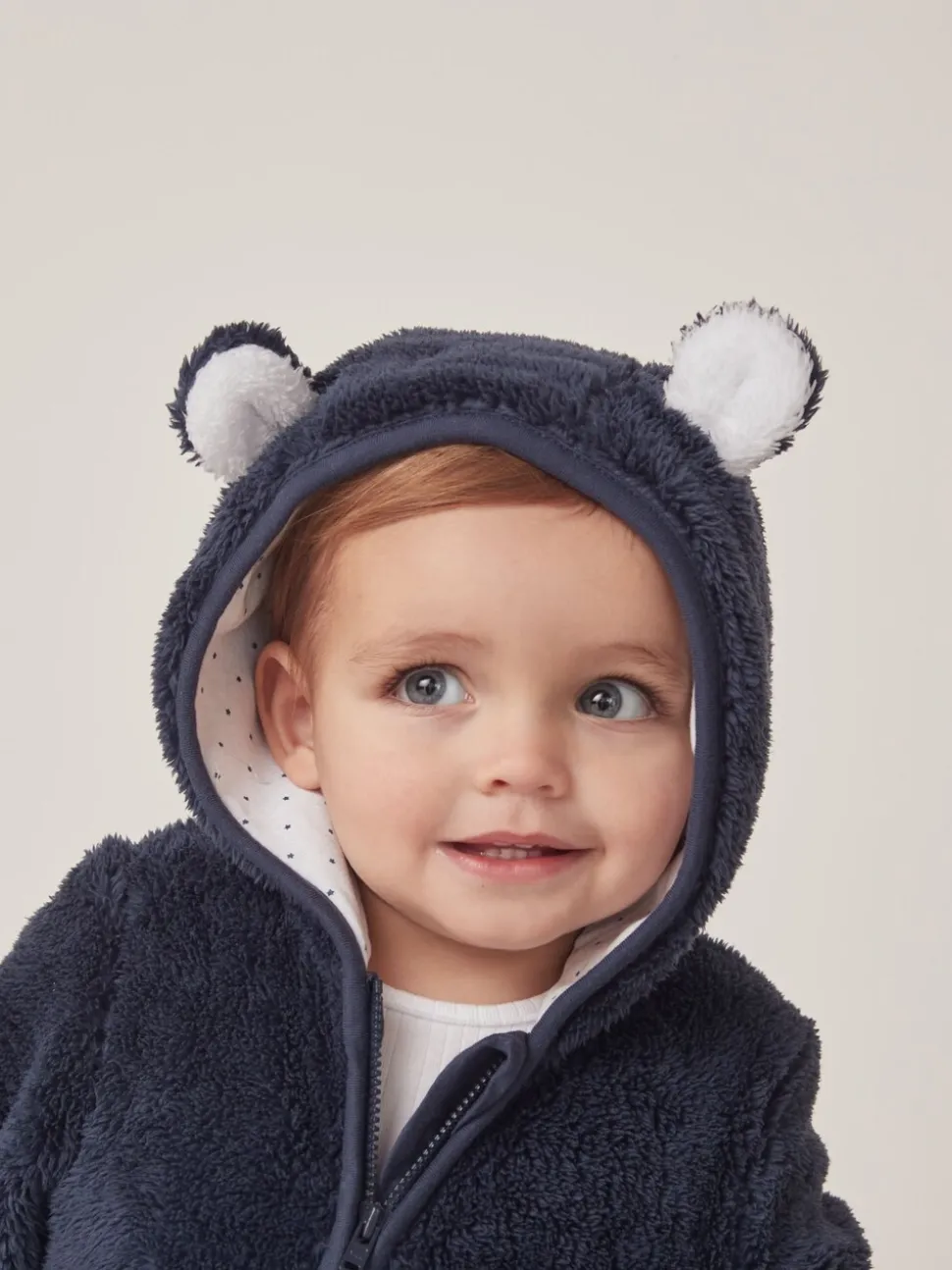 The White Company marineblauwe romper van fleece