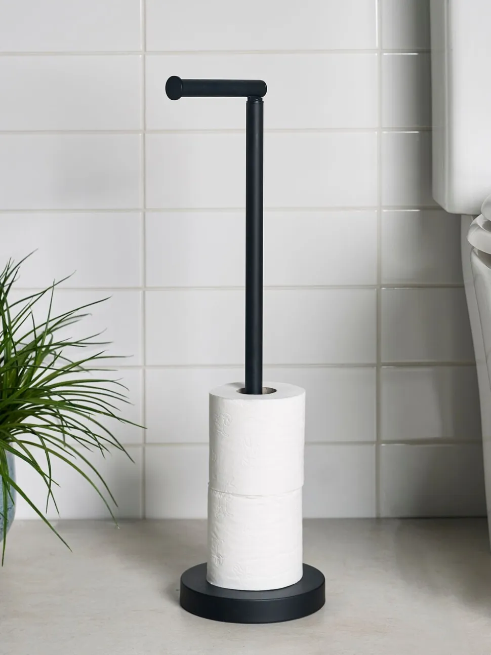 Toiletrolhouder met roterende bovenkant