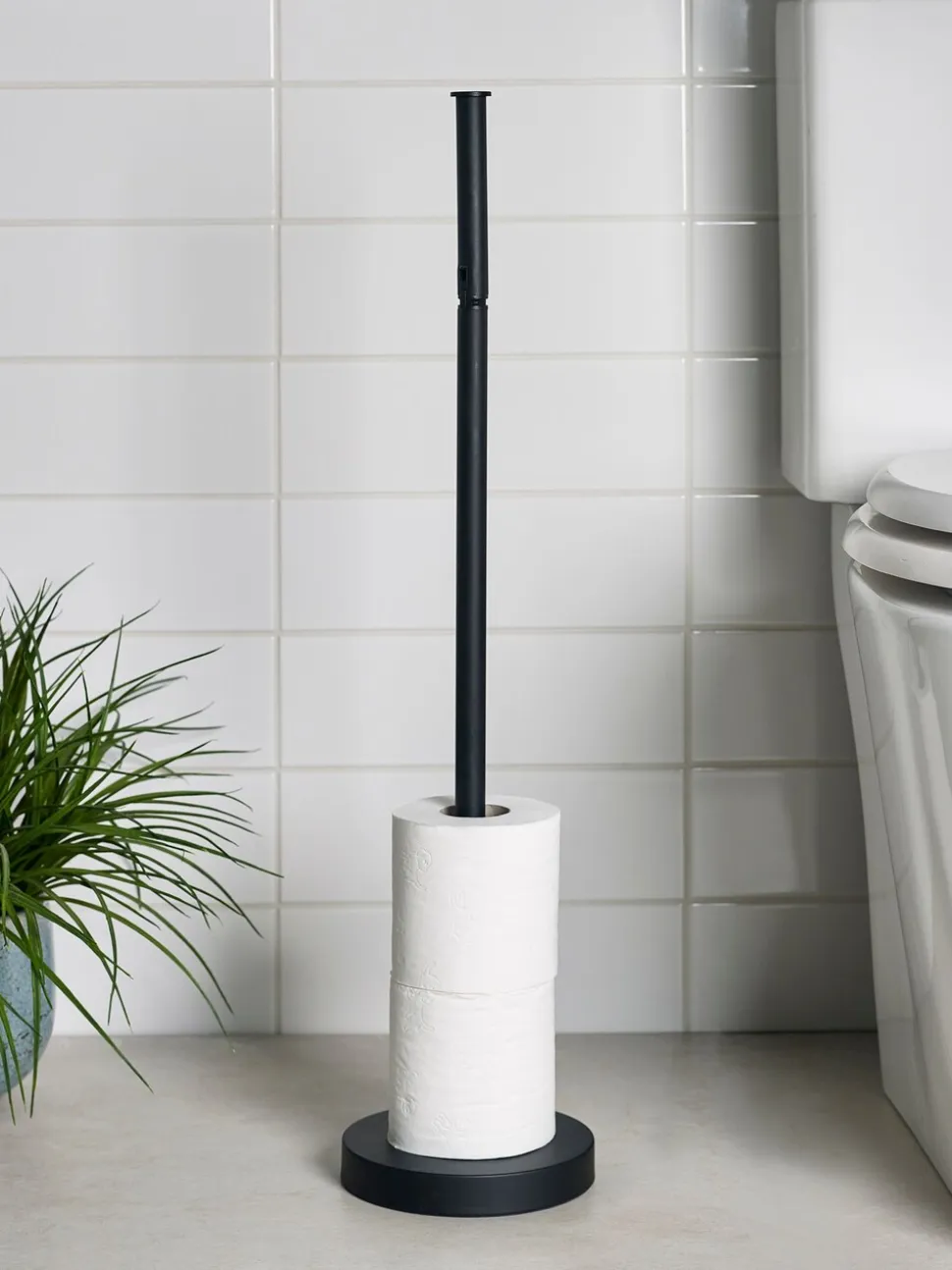 Toiletrolhouder met roterende bovenkant