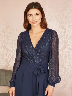 Yumi - Jumpsuit met lovertjes en lange mouwen