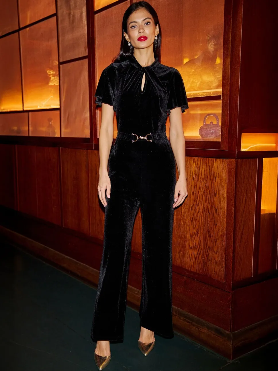 Yumi Velvet Jumpsuit With Twist Neckline And Buckle Belt