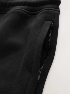 Zwart - Geborstelde jersey shorts met ritszakken