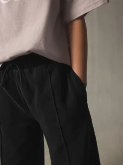 Zwart - Joggingbroek met wijde pijpen (3-16jr)