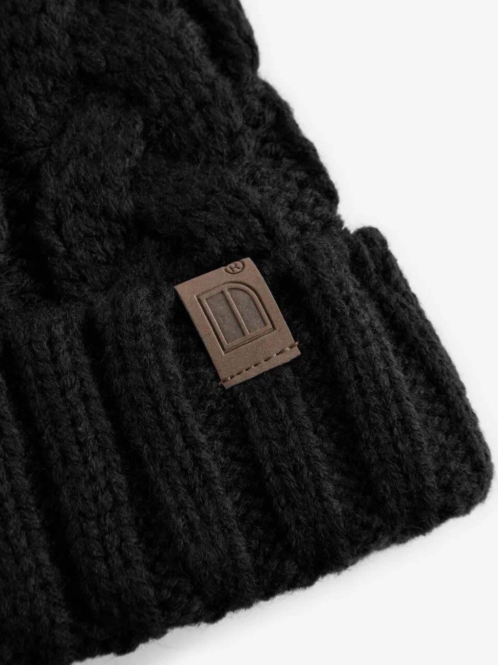 Zwart - Kabelgebreide muts met pompon (1-16jr)