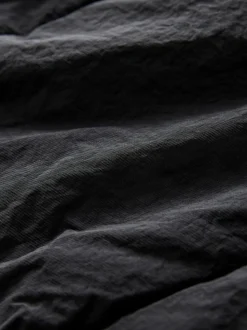 Zwart - Regenbestendige bodywarmer met capuchon en gebreide kraag