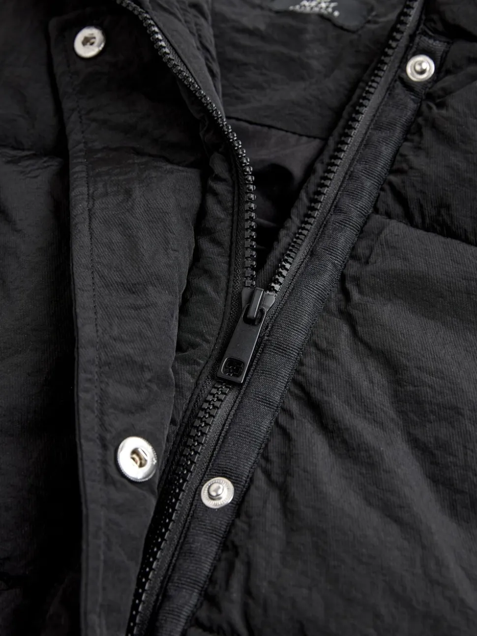 Zwart - Regenbestendige bodywarmer met capuchon en gebreide kraag