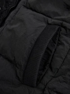 Zwart - Regenbestendige bodywarmer met capuchon en gebreide kraag