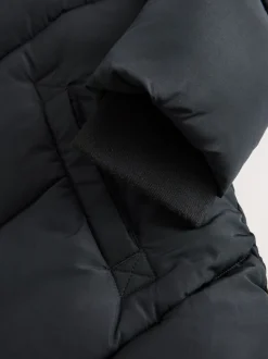 Zwart - Regenbestendige gewatteerde jas met capuchon en imitatiebontvoering (3 - 16 jr)