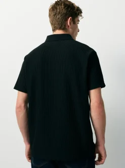 Zwart - Smart poloshirt met textuur en rits