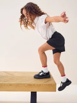 Zwart - Stretchy katoenen jersey schoolschort (3 - 16 jr)