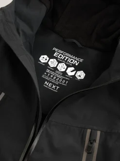 Zwart - Waterdichte jas met fleece voering en capuchon (3-17jr)