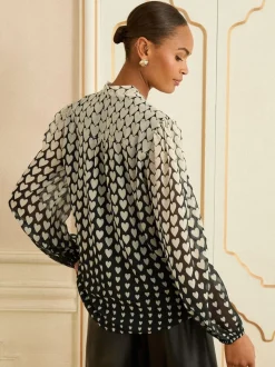 Zwart met hartjesprint - Love & Roses blouse met lange mouwen en striksluiting