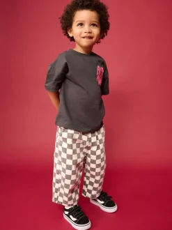 Zwart/wit met dambordpatroon - Wijde broek met elastische taille (3mnd-7jr)